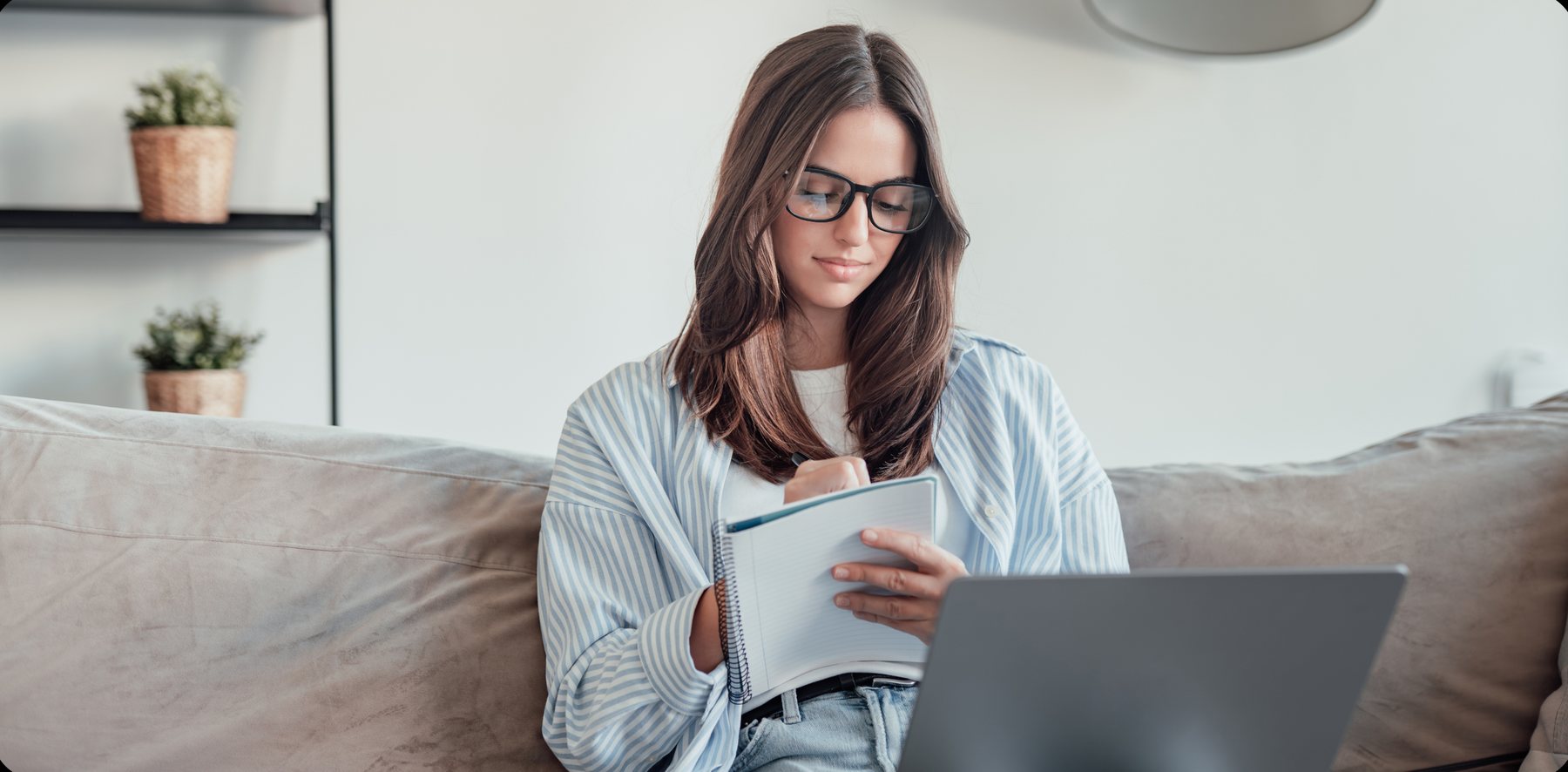 A product manager reviewing a secure, encrypted plan on her laptop